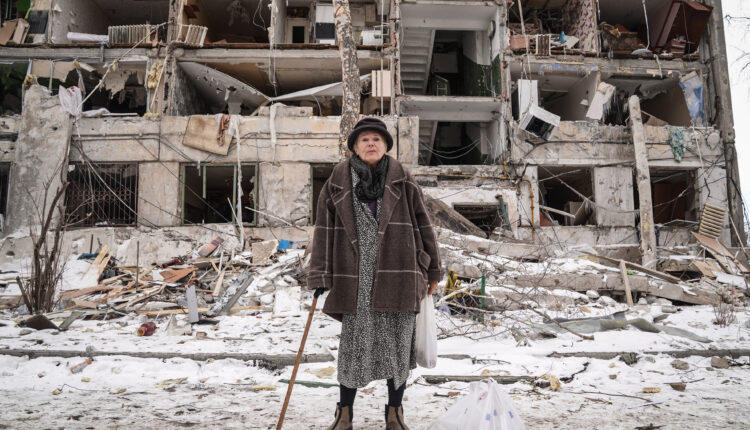 04_Andrey Bashtovoy_Larysa Oleksandrivna, 75, stands in front of the ruined facade of her house in the Pavlove Pole residential area